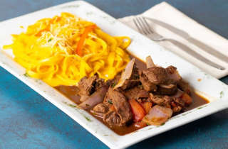 Producto FETUCCINE A LA HUANCAINA CON LOMO SALTEADO